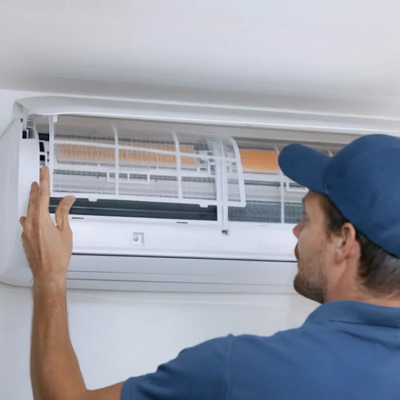 AC Repair Newark technician servicing a wall-mounted air conditioner